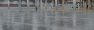 Empty factory building or warehouse building with concrete floor for industry background.