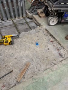 Concrete slab demolition and removal prior to epoxy flooring installation