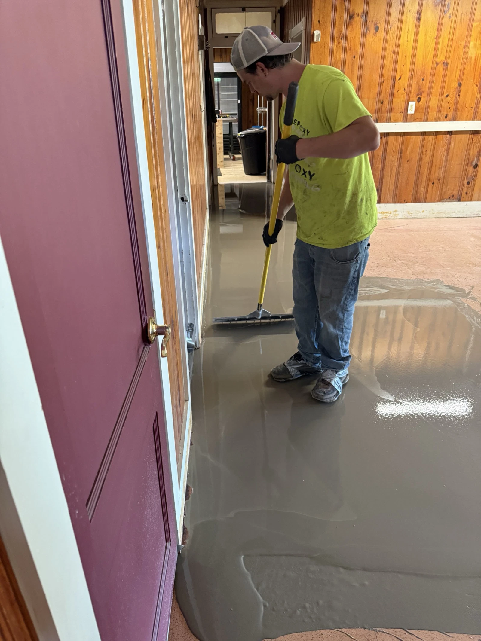 Commercial epoxy floor coating application in progress