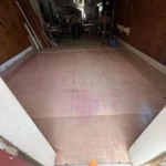 Existing commercial concrete floor before epoxy flooring installation and surface preparation