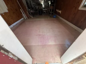 Existing commercial concrete floor before epoxy flooring installation and surface preparation