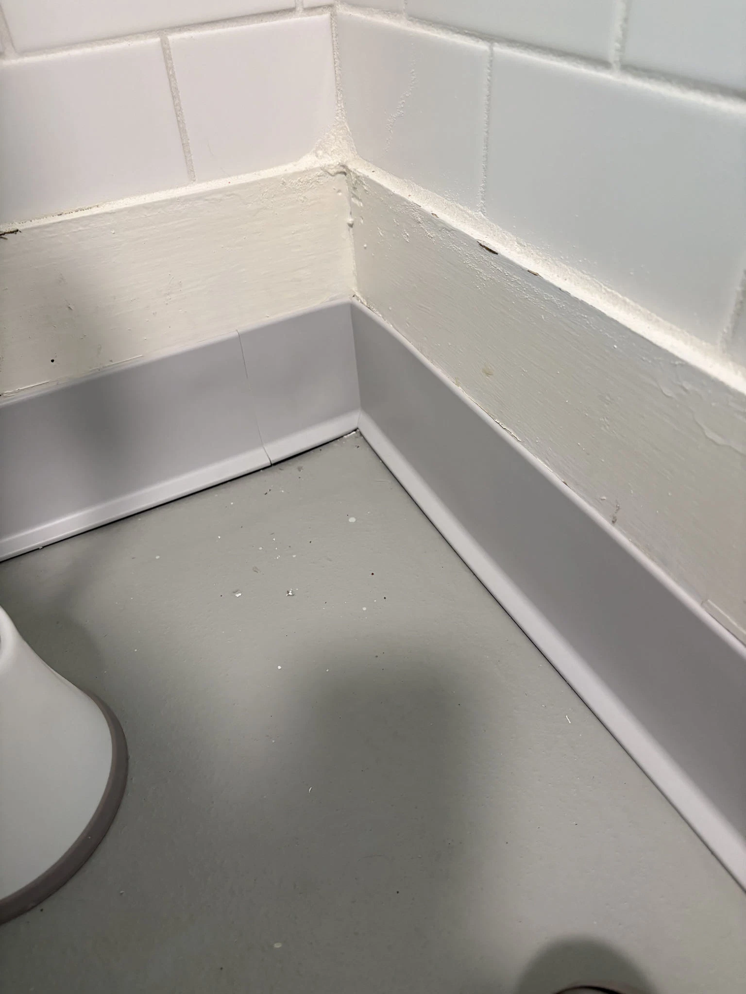 Vinyl cove base detail installed with commercial epoxy floor